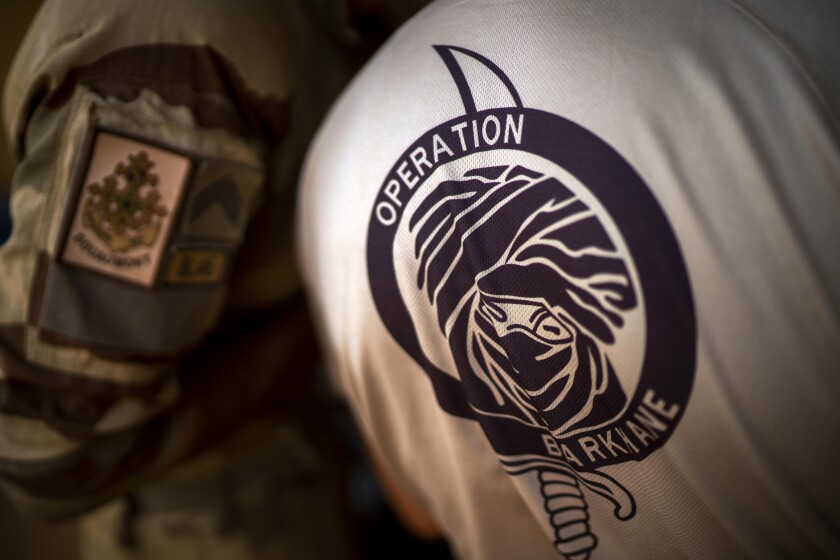 FILE - French Barkhane force soldiers who wrapped up a four-month tour of duty in the Sahel leave their base in Gao, Mali, June 9, 2021. France said Sunday, Jan. 23, 2022 that one of its soldiers has been killed in an attack on a base in Mali.A French Army statement said the 24-year-old artilleryman, Alexandre Martin, was serving with France’s anti-insurgent force Operation Barkhane. (AP Photo/Jerome Delay, file)