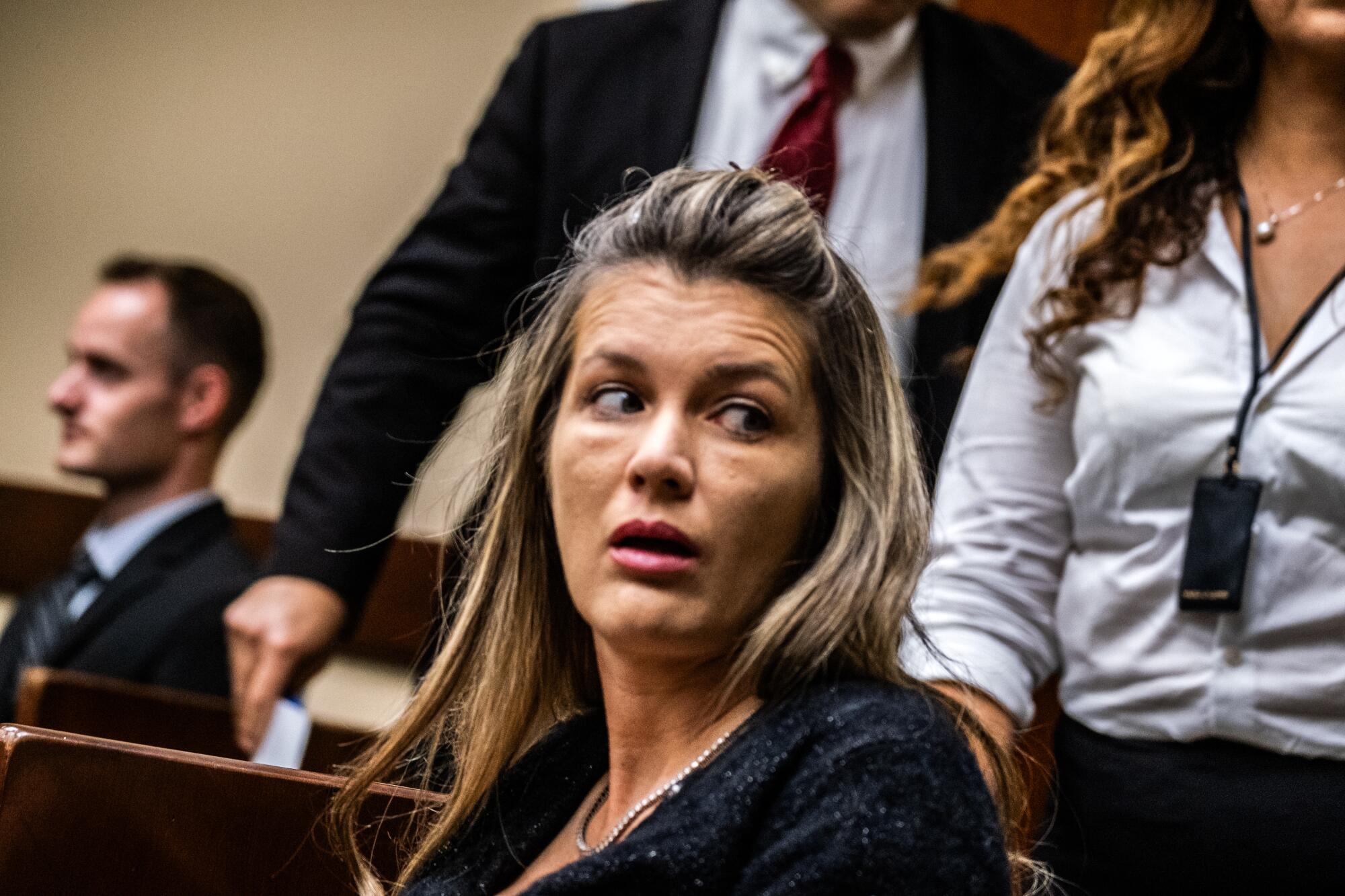 Monique Matthews seated in a courtroom in Riverside