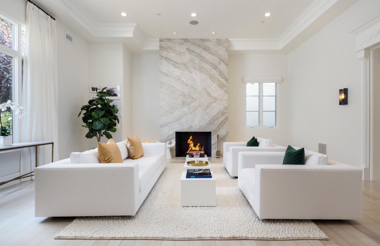 A dramatic floor-to-ceiling fireplace is a room's centerpiece.