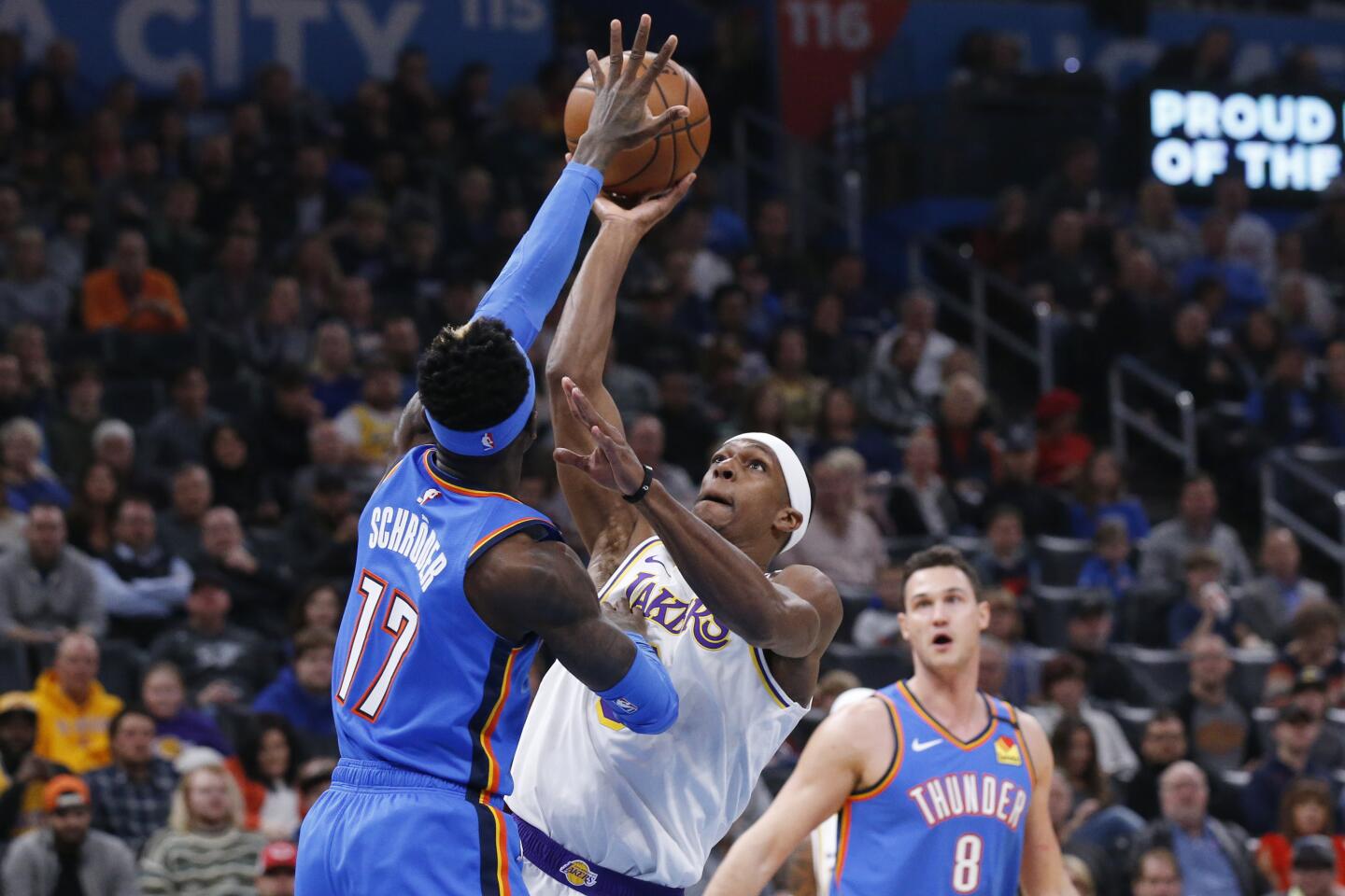 Lakers guard Rajon Rondo shoots over Thunder guard Dennis Schroder during the first half of a game Jan. 11 at Chesapeake Energy Arena.