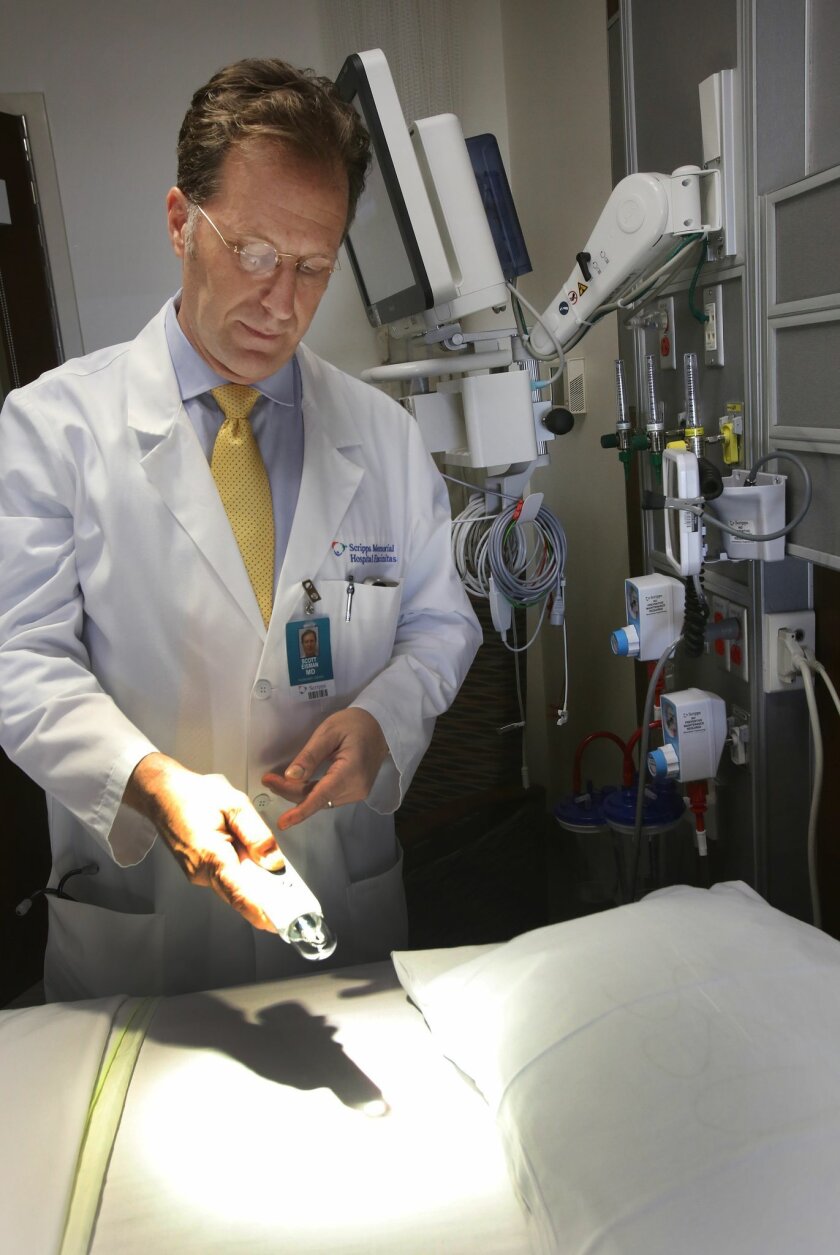 Dr. Scott Eisman demonstrates a lighting remote-control system in a patient room at the new critical care building at Scripps Memorial Hospital in Encinitas. / photo by Bill Wechter * U-T San Diego