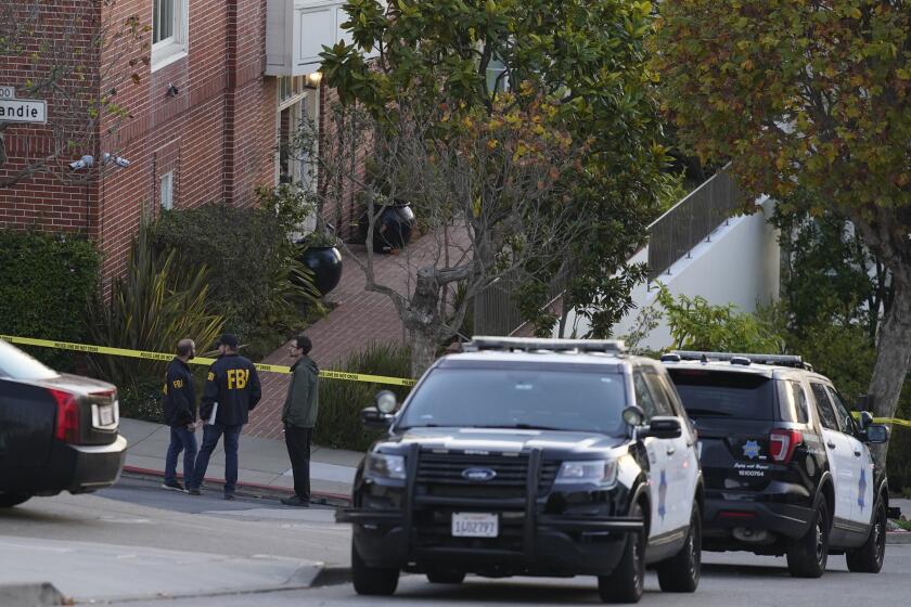 FBI agents work outside the home of Paul Pelosi, the husband of House Speaker Nancy Pelosi, in San Francisco, Friday.