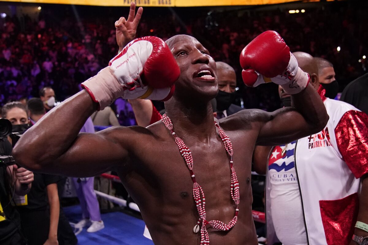 Yordenis Ugas, of Cuba, celebrates his unanimous decision win over Manny Pacquiao, of the Philippines