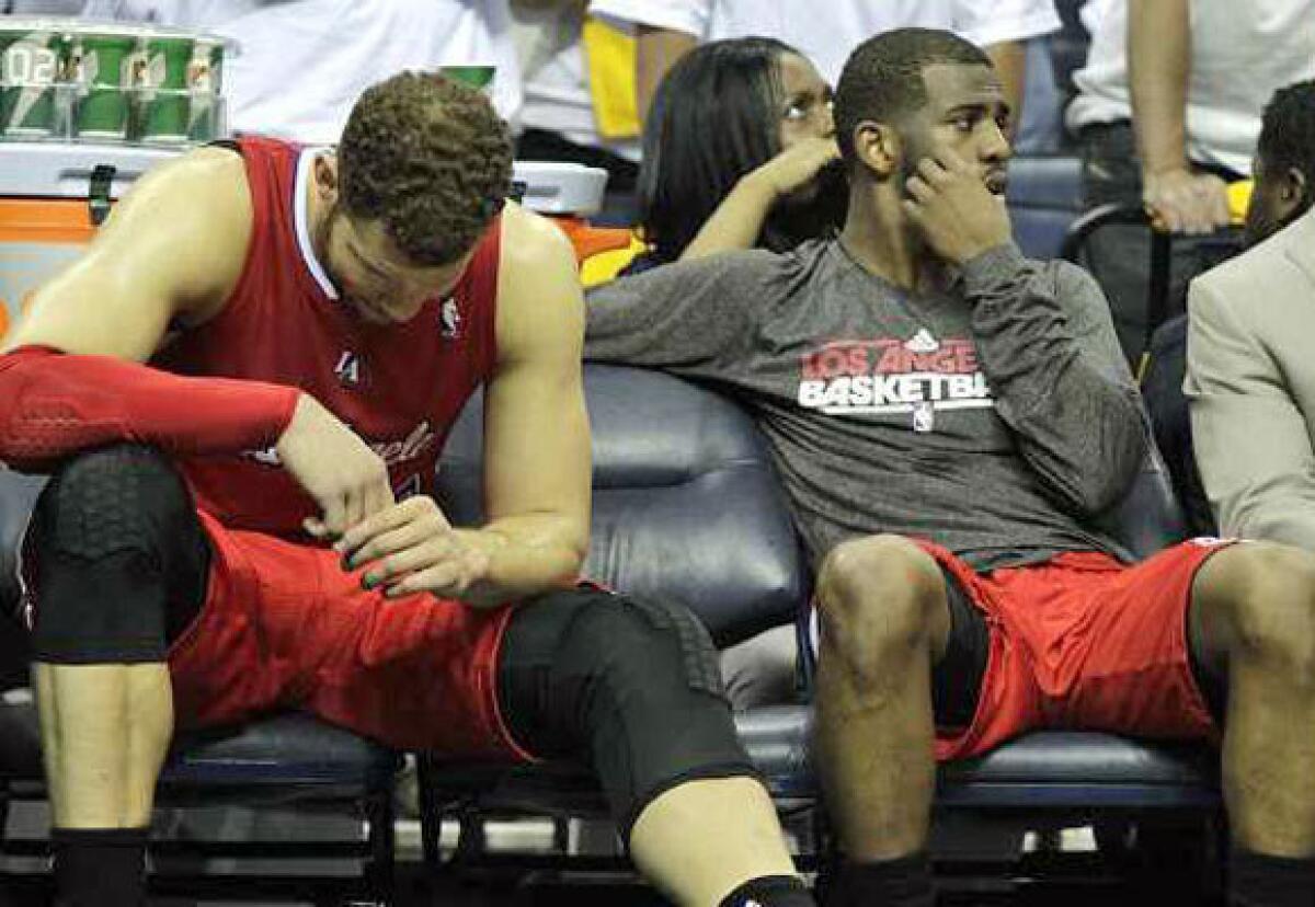 Blake Griffin, left, and Chris Paul of the Clippers sit on the bench during the Game 5 loss to Memphis.