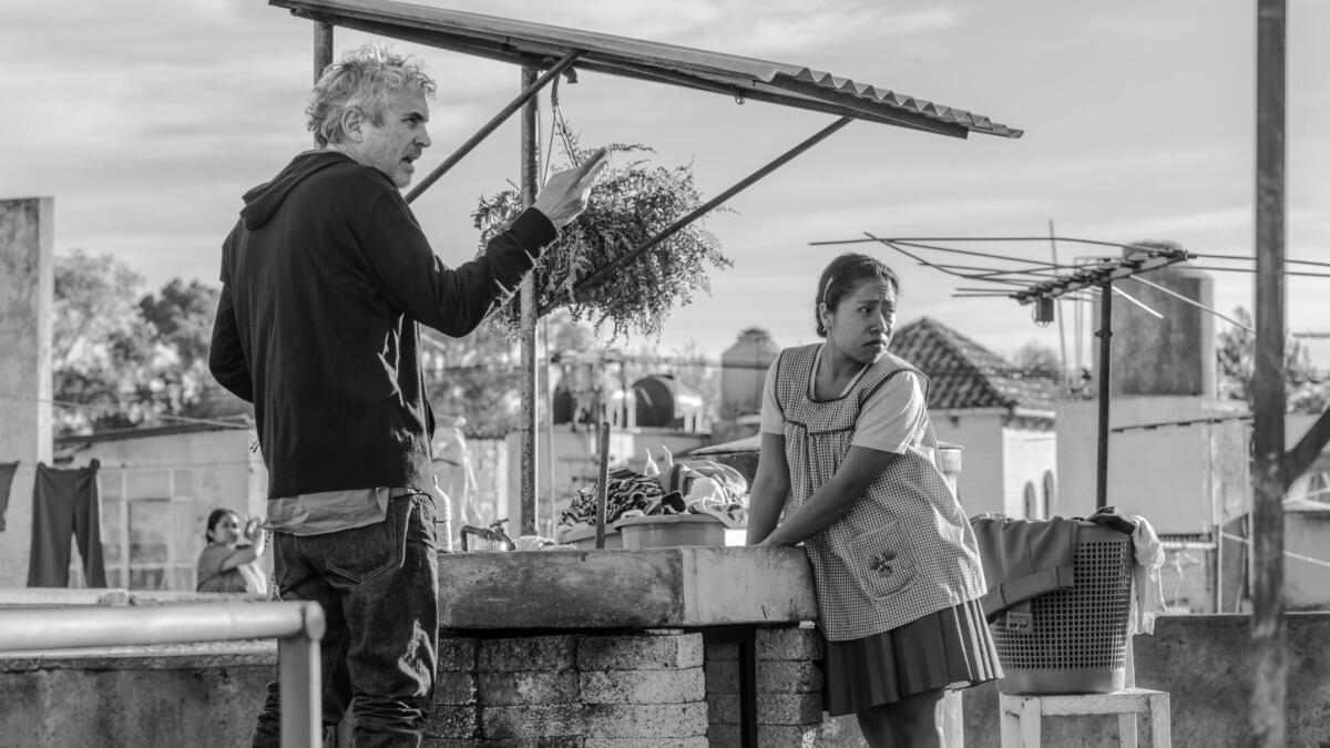 Alfonso Cuaron, left, and Yalitza Aparicio on the set of "Roma."