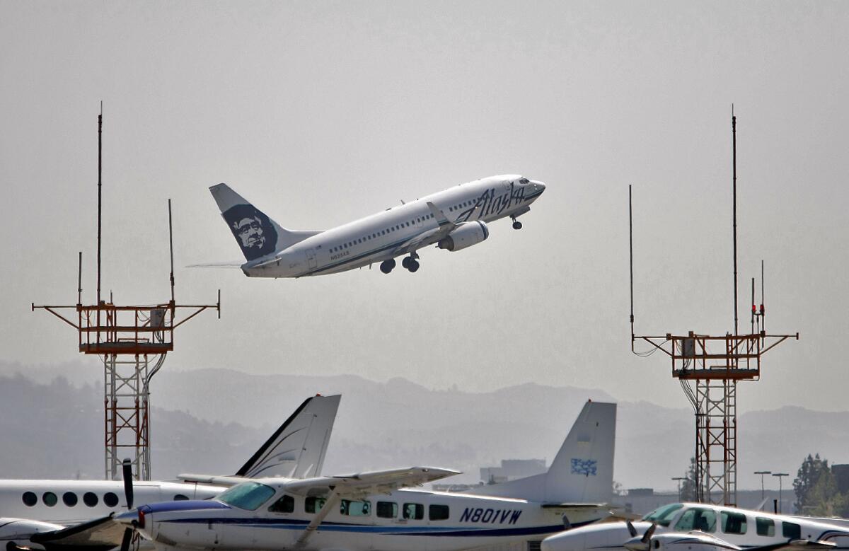 An Alaska Airlines plane takes off from the Burbank Airport on Saturday, March 23, 2013.