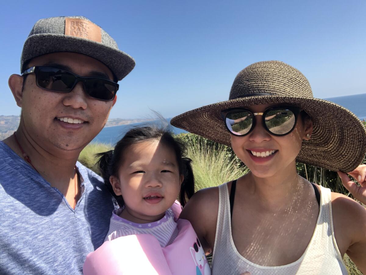 Elvin Lai with his wife, Nan, and their daughter, Aanya.