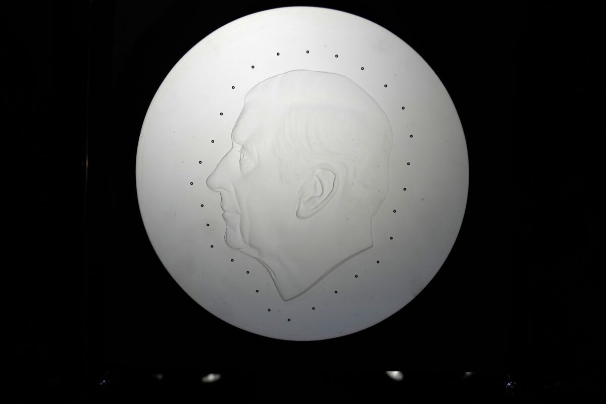 The template created by British sculptor Martin Jennings for the official portrait of King Charles III for use on coins on display during a press preview in London, Thursday, Sept. 29, 2022. Two new coins bearing the kings portrait were displayed a commemorative 5 pound coin, and a new 50 pence coin. (AP Photo/Alastair Grant)