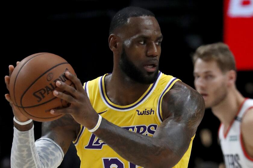 Lakers forward LeBron James looks for an open teammate in the first quarter.