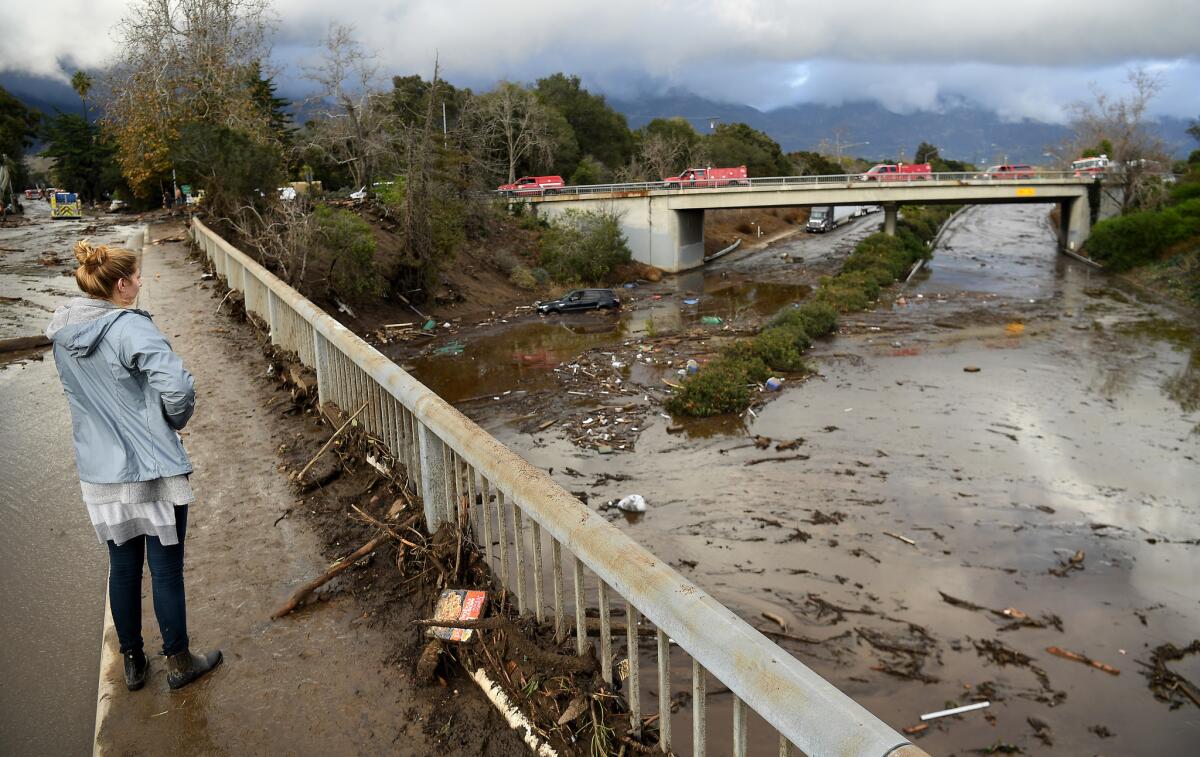 The 101 Freeway is flooded with mud and debris at Olive Mill Road in Montecito.