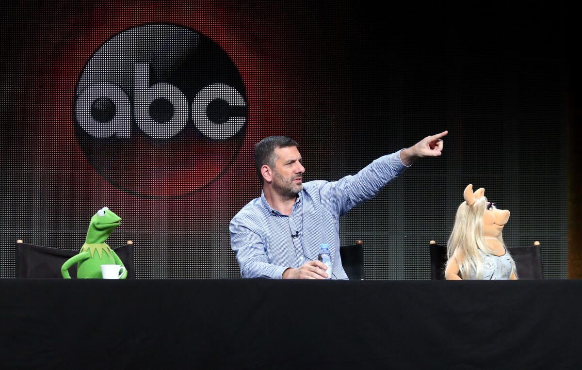 Kermit the Frog, writer/executive producer Bob Kushell and Miss Piggy speak during the "The Muppets" panel discussion at the ABC Entertainment portion of the 2015 Summer TCA Tour at The Beverly Hilton Hotel on Aug. 4, 2015 in Beverly Hills.