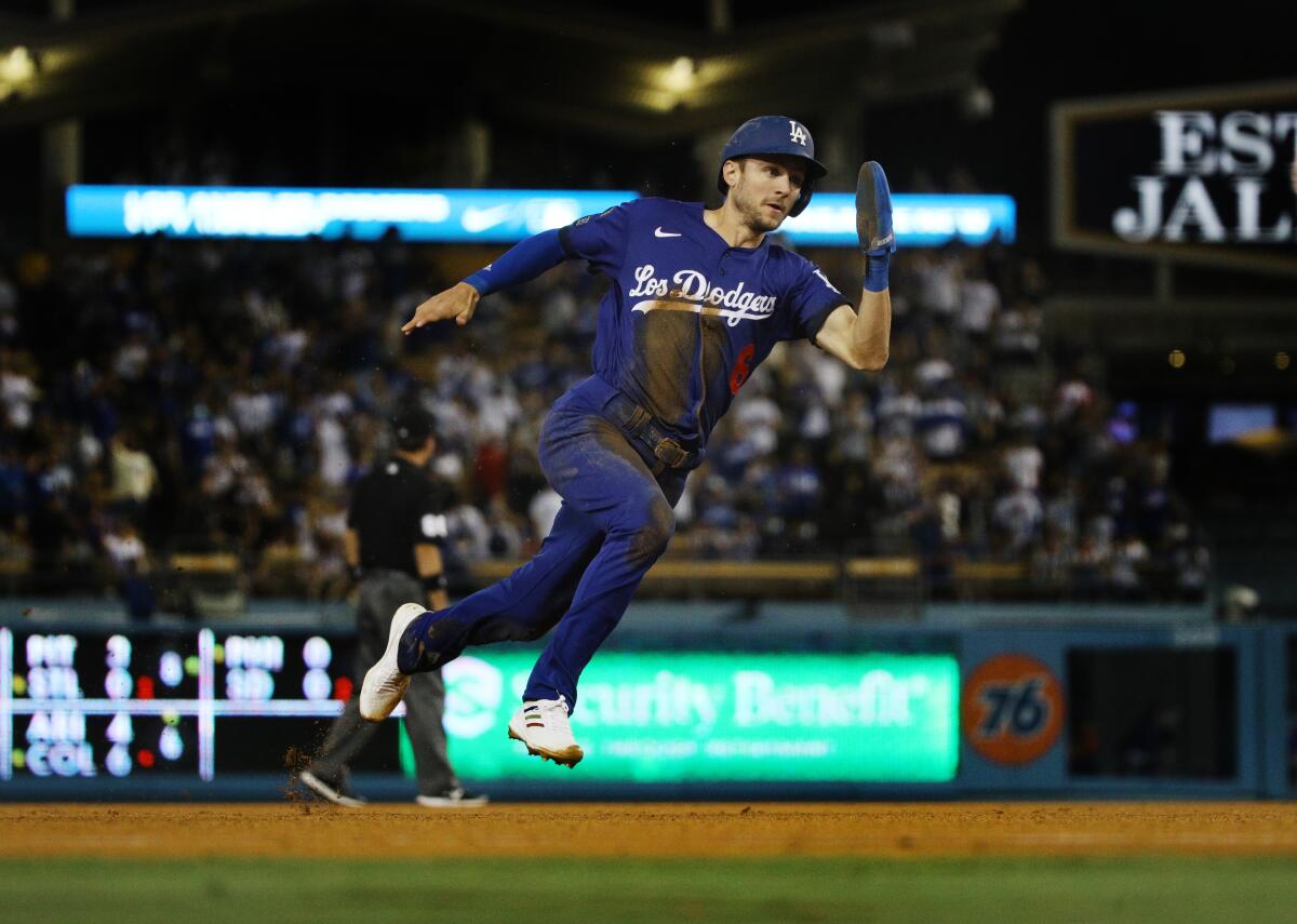 Dodgers second baseman Trea Turner speeds around the bases to score from first base on an RBI double.