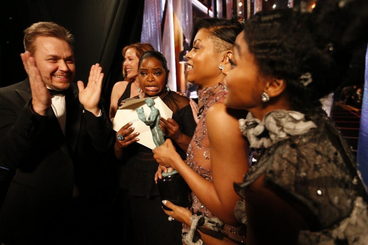 "Hidden Figures" writer-director Theodore Melfi and actors Octavia Spencer, Taraji P. Henson and Janelle Monáe celebrate after winning for outstanding performance by a cast in a motion picture.