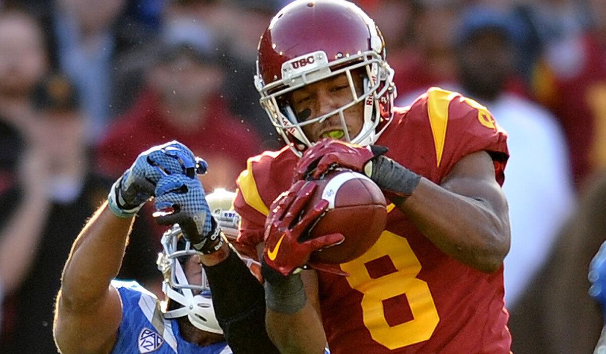 USC cornerback Iman Marshall intertcepts a pass intended for UCLA's Jordan Payton.