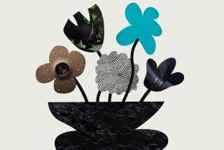 flower cutouts with different textures and colors arranged in a black geometric stone vase