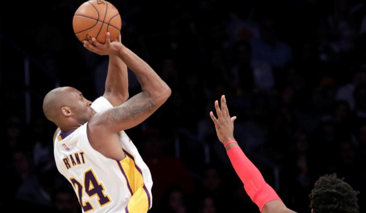 Lakers star Kobe Bryant makes a jump shot.