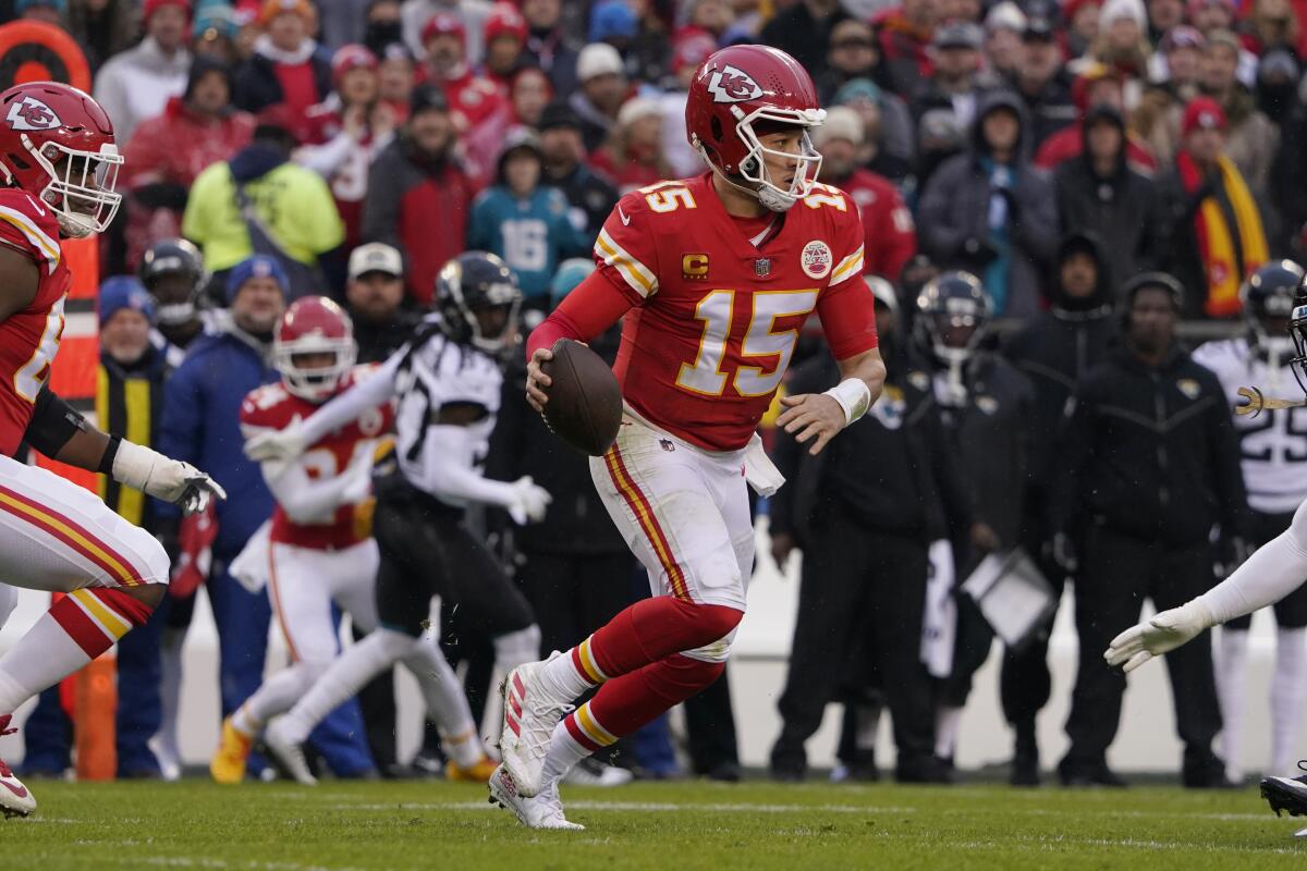 Kansas City quarterback Patrick Mahomes scrambles against Jacksonville during a divisional playoff game Jan. 21, 2023.