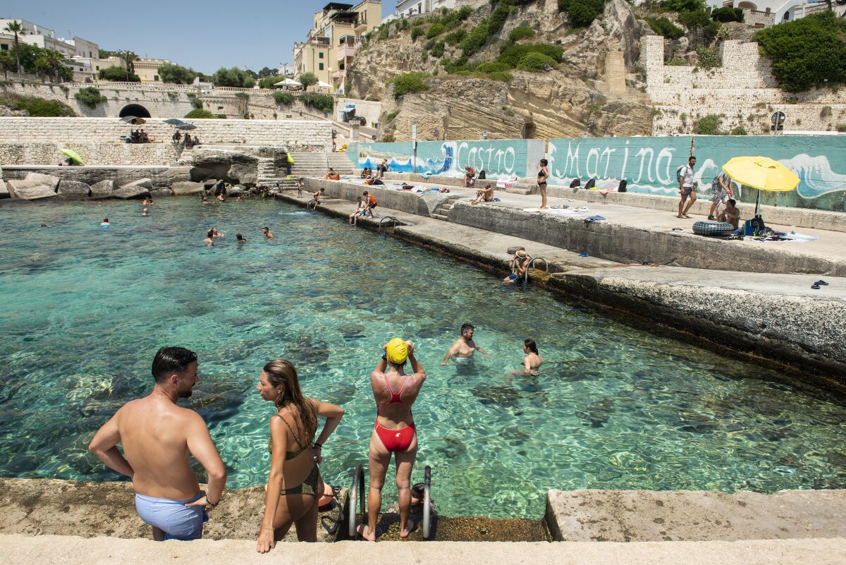 The port of Castro Marina, Italy, where the docks and rocks provide natural diving boards into the Adriatic sea.