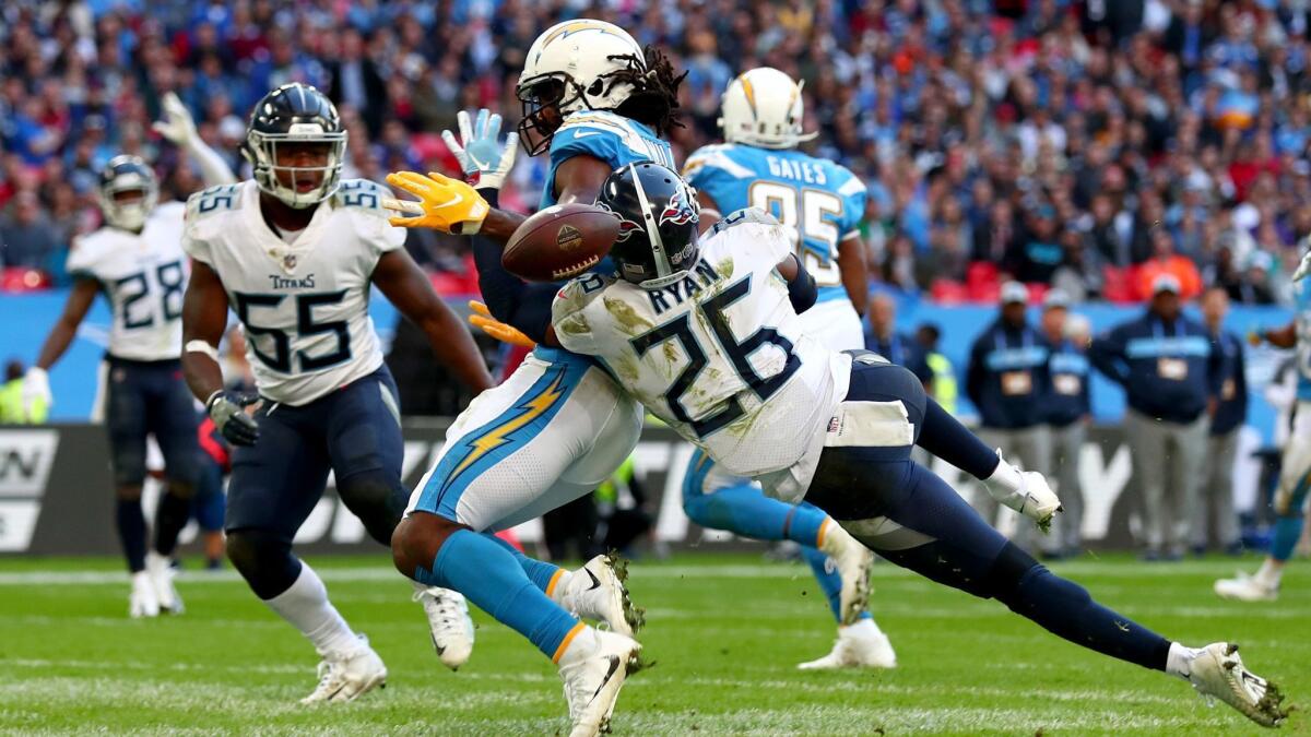 The Chargers' Tyrell Williams is denied a touchdown by the Tennessee Titans' Logan Ryan during an Oct. 21 game at Wembley Stadium in London.