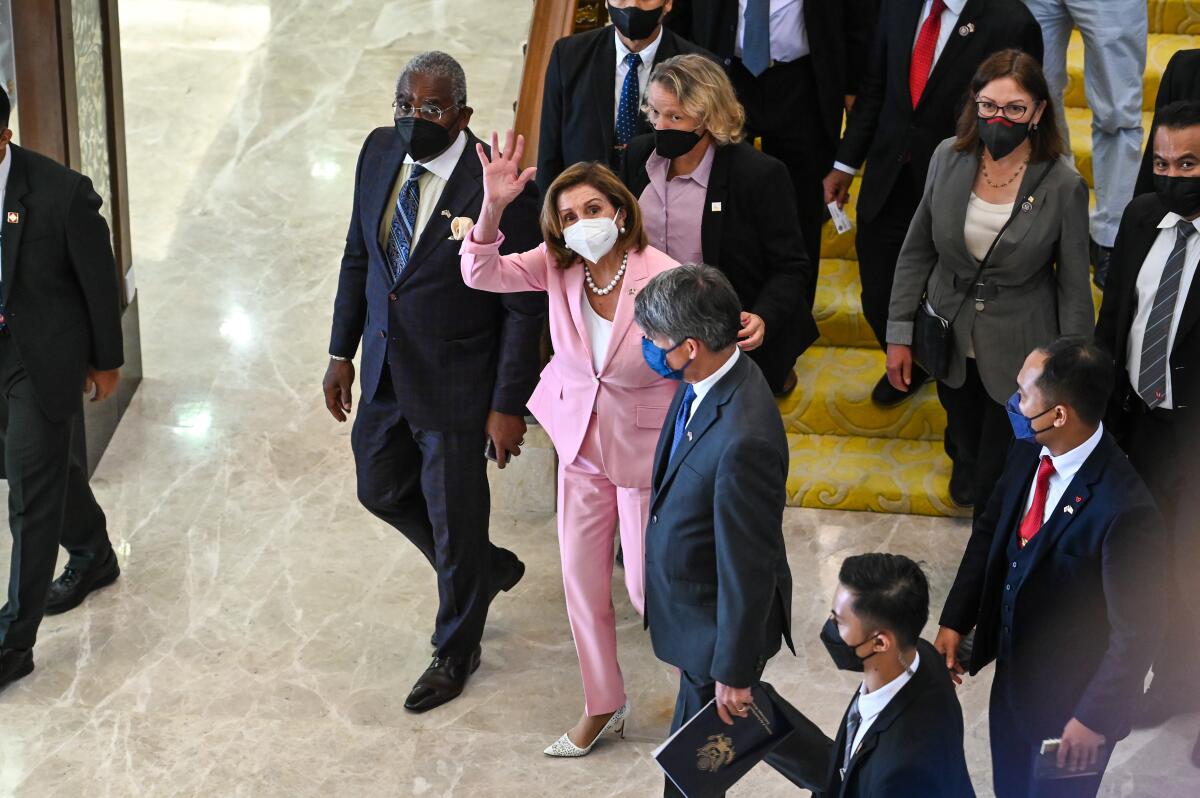 House Speaker Nancy Pelosi waving