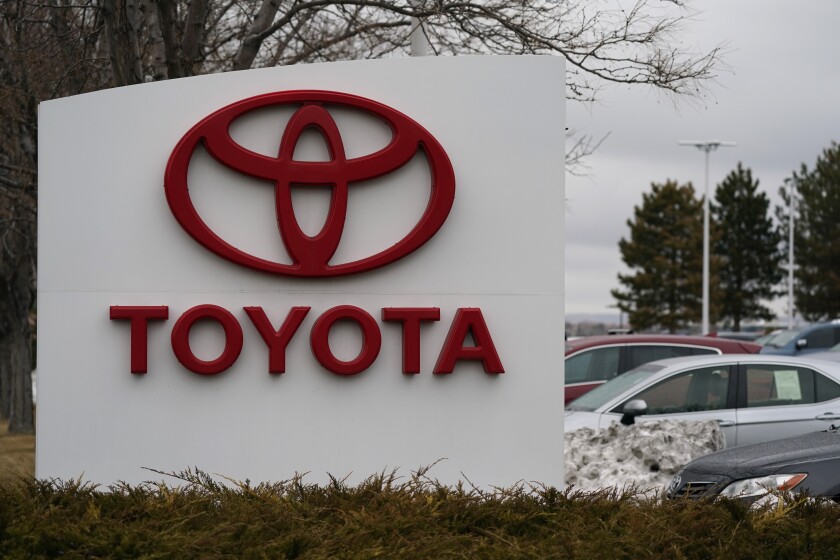 The company logo adorns a sign outside a Toyota dealership Sunday, March 21, 2021, in Lakewood, Colo. Toyota reported Wednesday, May 12, 2021, its January-March profit more than doubled from the previous year to 777 billion yen ($7 billion), as the Japanese automaker’s sales gradually recovered from the damage of the coronavirus pandemic. (AP Photo/David Zalubowski)