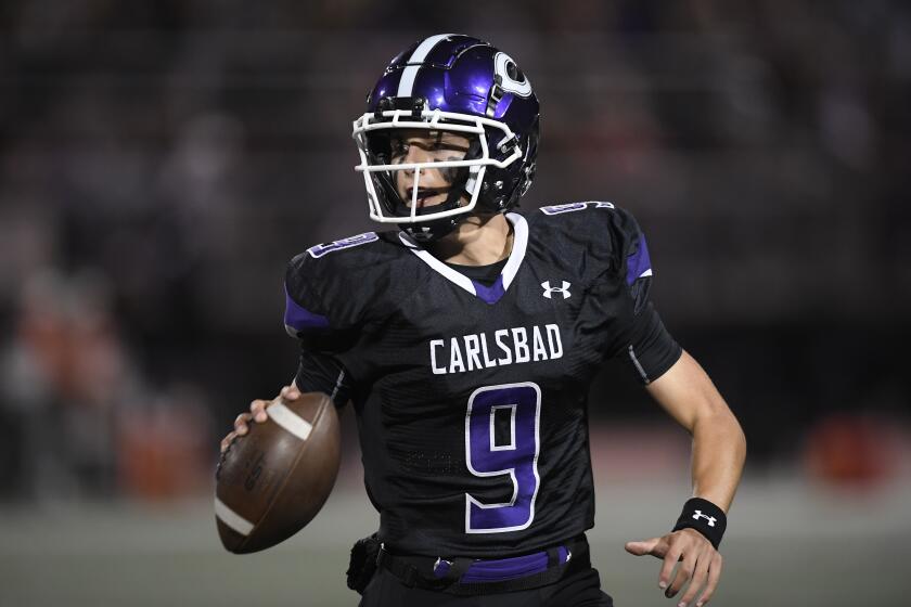 Carlsbad's Julian Sayin looks to pass during the first half of a high school football game against Torrey Pines October 1, 2021 in Carlsbad, Calif. (Photo by Denis Poroy)