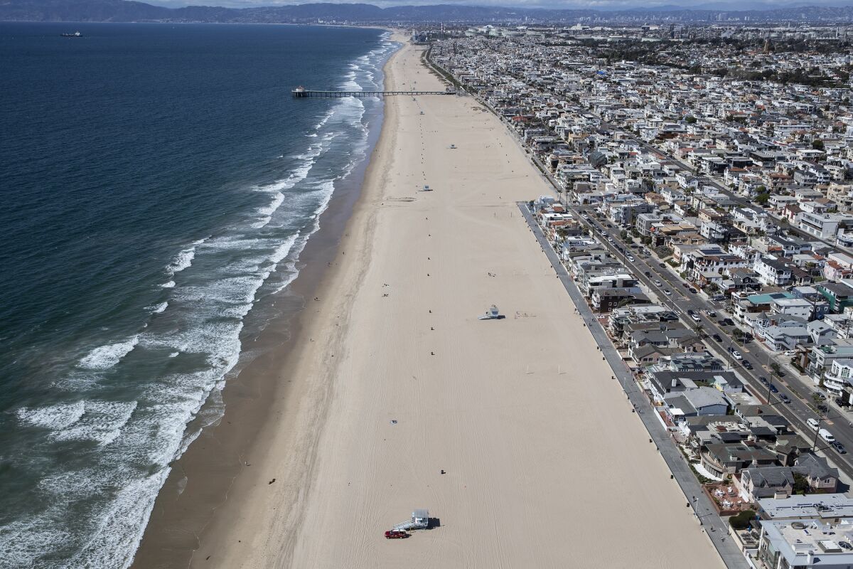 Hermosa Beach is all but empty days after all beaches in parks were closed due to the Coronavirus outbreak.