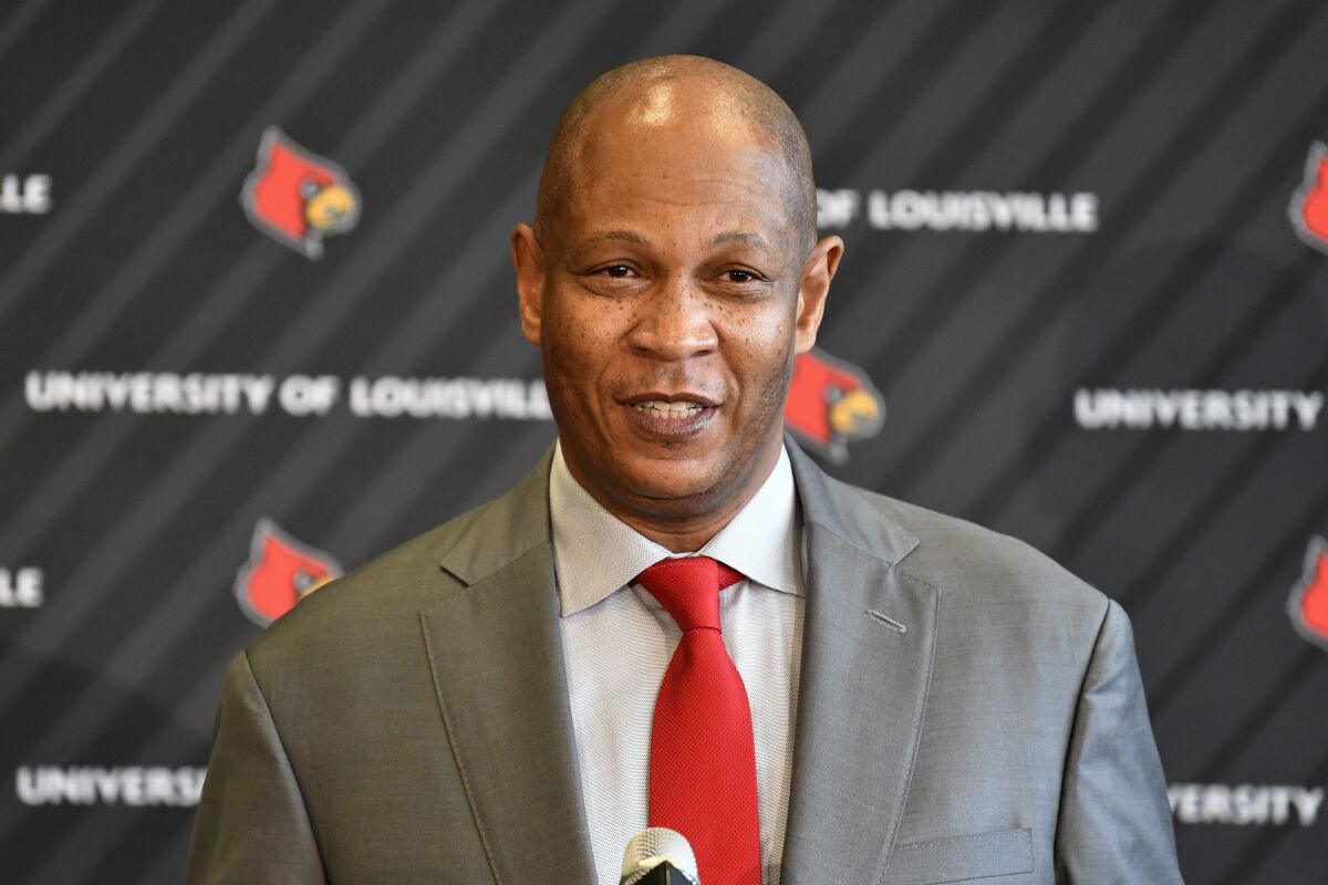 Kenny Payne, new head coach of the Louisville NCAA men's college basketball team, speaks during an introductory press conference at the KFC Yum! Center in Louisville, Ky., Friday, March 18, 2022. (AP Photo/Timothy D. Easley)