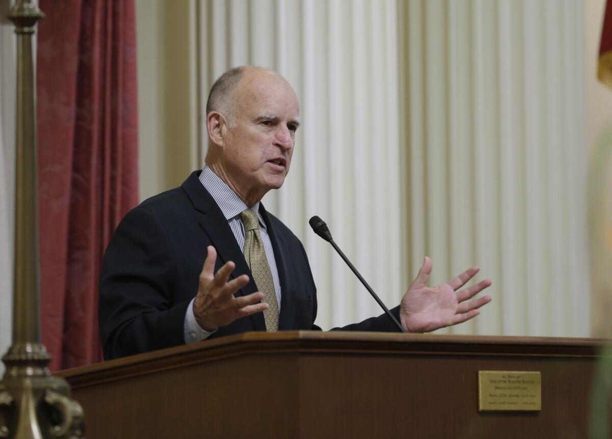 Gov. Jerry Brown delivers remarks at the state Capitol on Wednesday.