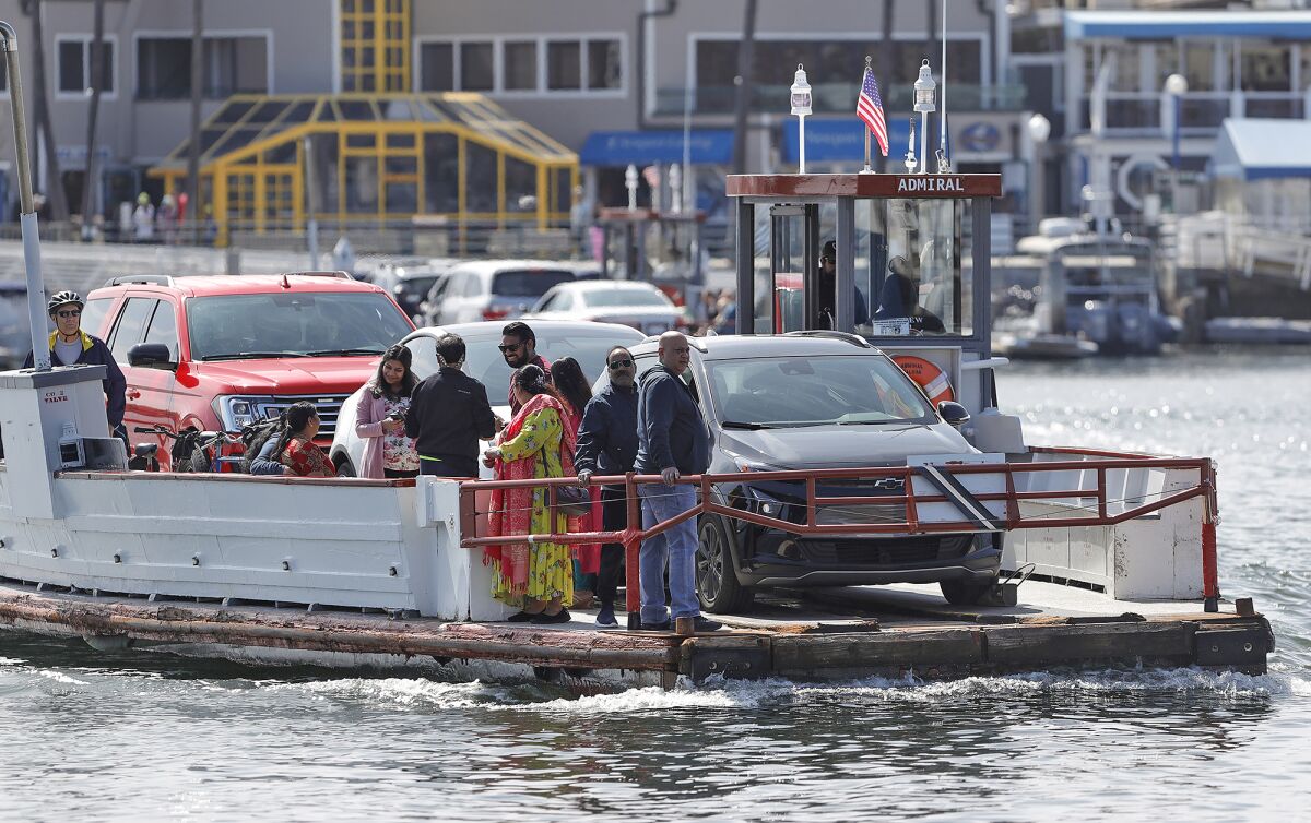 The Admiral ferry boat transports cars and people across the Newport Harbor.