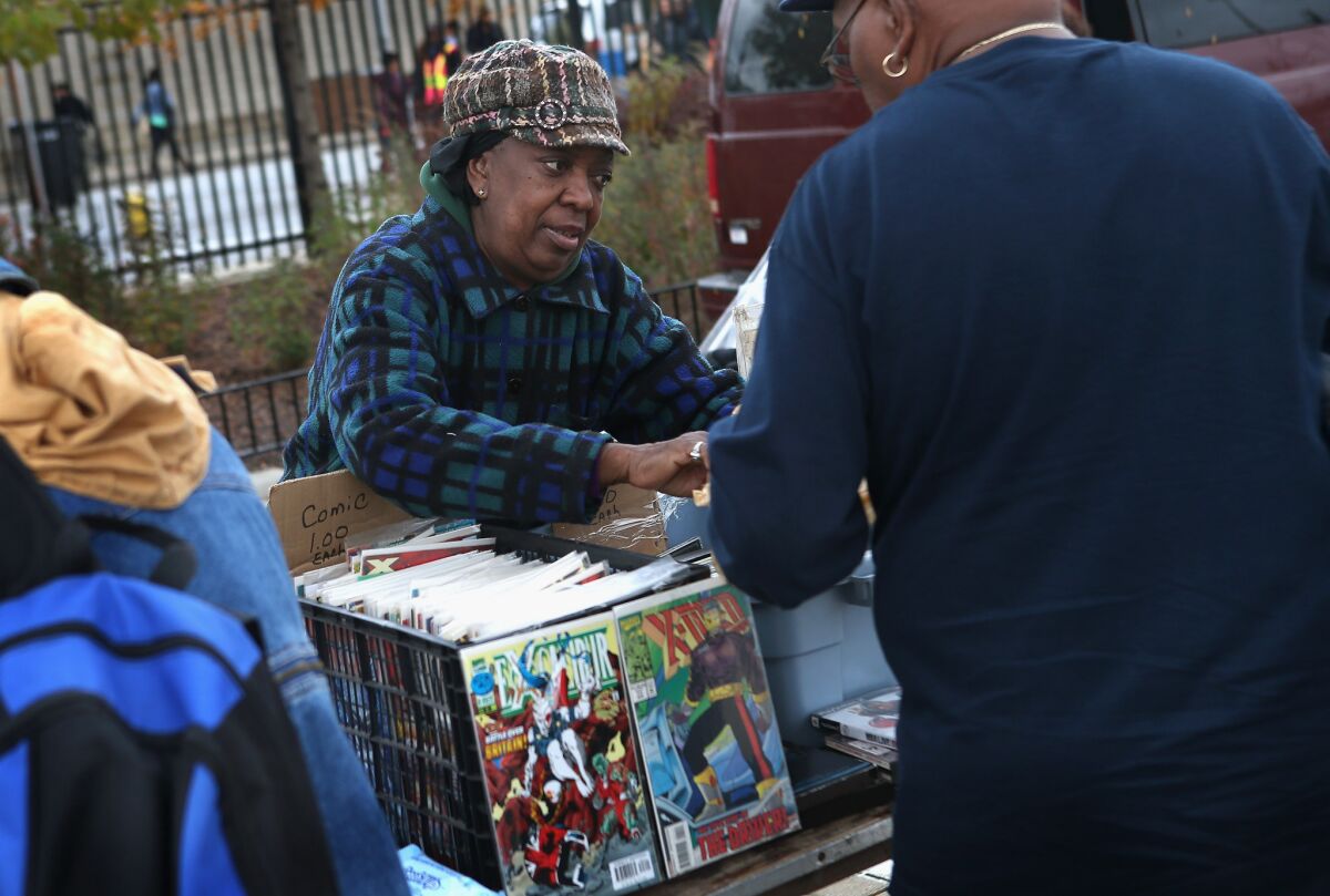 Annie Smith sells comic books and CDs at the century-old Maxwell Street Market on in Chicago, Ill. The Supreme Court heard a case Monday that could decide how much control manufacturers can exert over their products after they¿ve been sold.