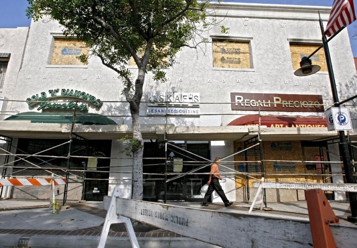 The commercial building at 233 N. Brand Blvd. in Glendale caught fire in May and it is still being rebuilt on Wednesday. It may take up to six months to have the building habitable again.