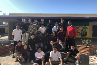 Students in Roosevelt Johnson's Man Up program, which Johnson started to help Black boys succeed, meet on Friday mornings at Wilson Middle School in San Diego to hear from Black speakers and learn about their history.