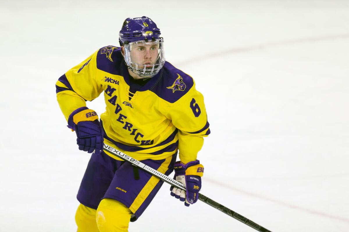 FILE - Minnesota State's Parker Tuomie skates against Bemidji State during an NCAA hockey game in Mankato, Mich., in this Friday, March 1, 2019, file photo. While major leagues mostly managed to make a season out of the pandemic, scores of athletes on the lower-profile levels of sports temporarily lost the chance to compete because of the COVID-19 outbreak. Parker Tuomie and the Minnesota State hockey team had their chase for the program's first NCAA championship ended abruptly a year ago. Tuomie, a native of Germany, now plays professionally in Berlin. (AP Photo/Andy Clayton-King, File)
