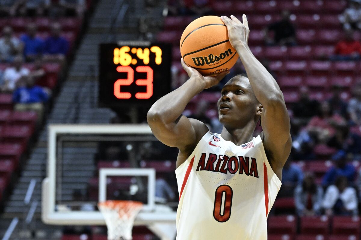 FILE - Arizona guard Bennedict Mathurin (0) shoots against Wright State during the first half of a first-round NCAA college basketball tournament game on March 18, 2022, in San Diego. Mathurin is a lottery prospect and one of the top wings in this year's NBA draft. (AP Photo/Denis Poroy, File)
