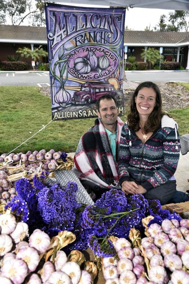 Claire and Ben Ronniger of www.AllicinsRanch.com with garlic from their farms