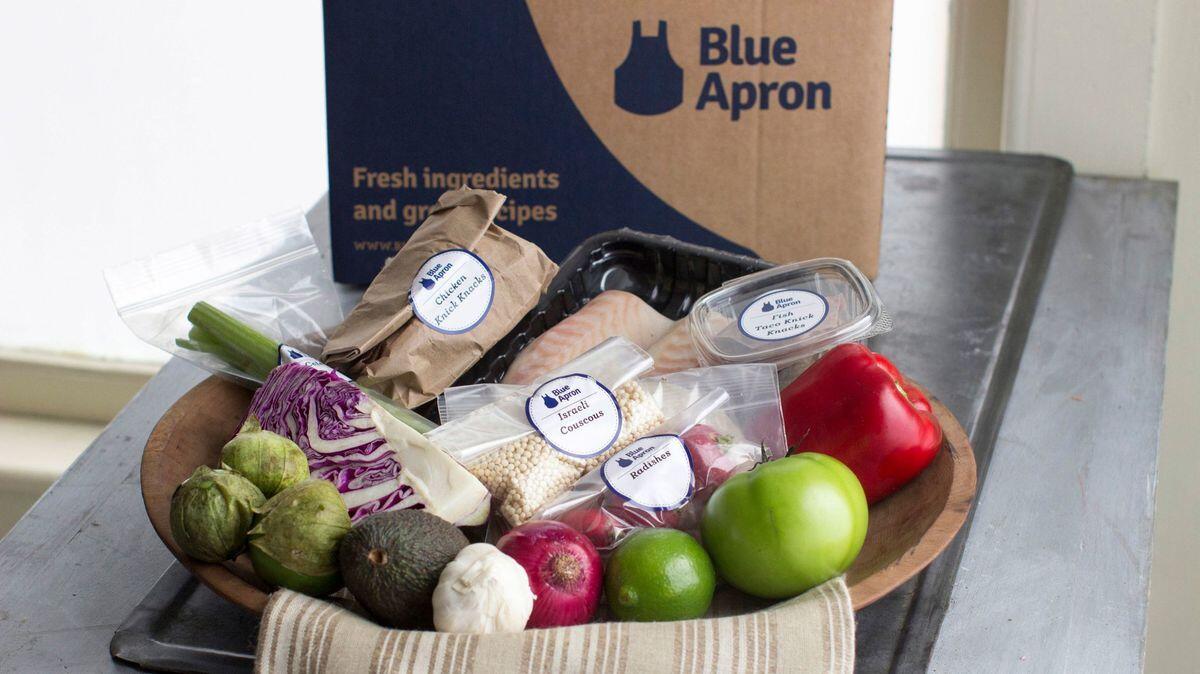 This 2014 photo shows an example of a home delivered meal from Blue Apron, a New Hampshire firm.