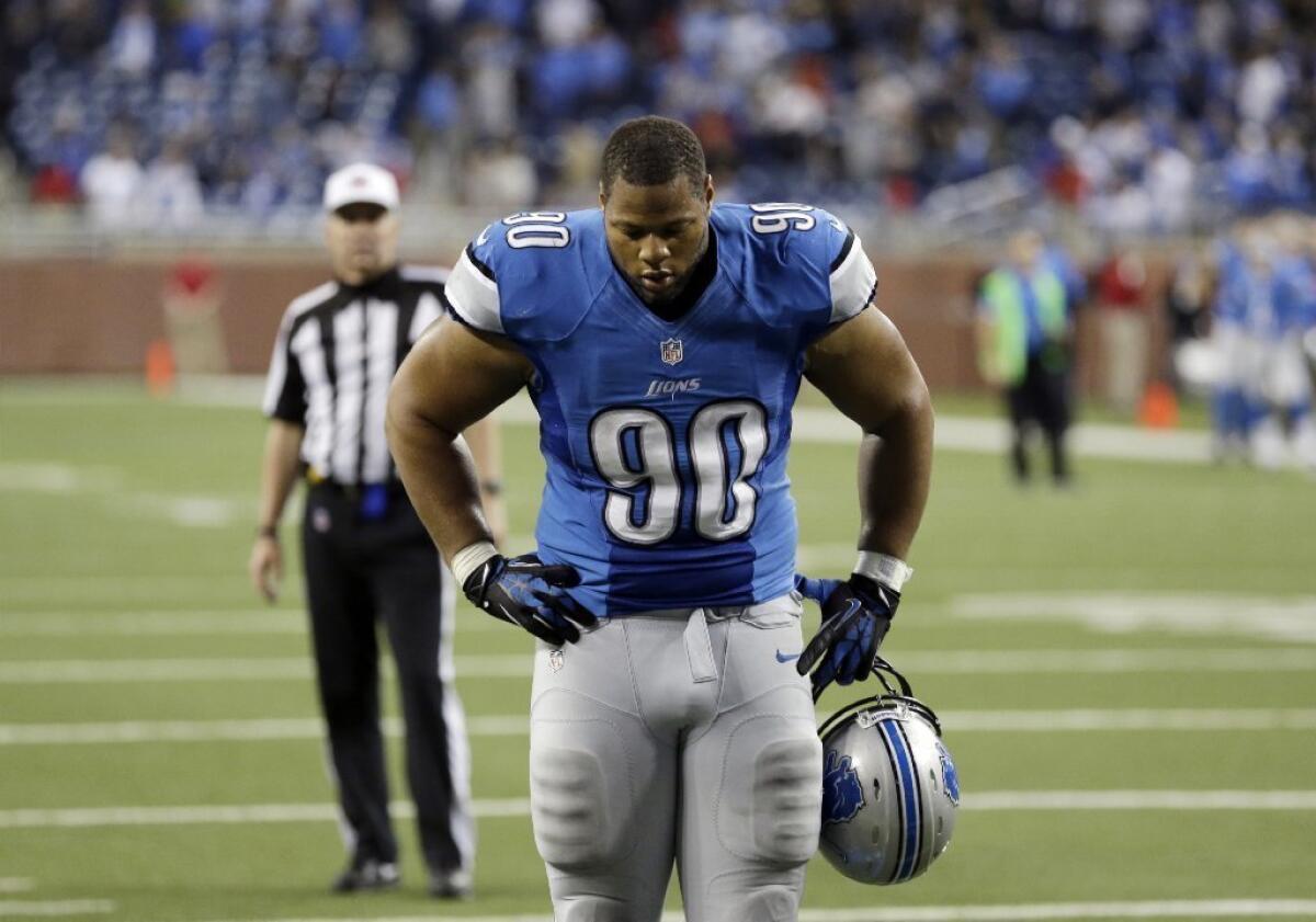Ndamukong Suh walks off the field after a game against the Colts.