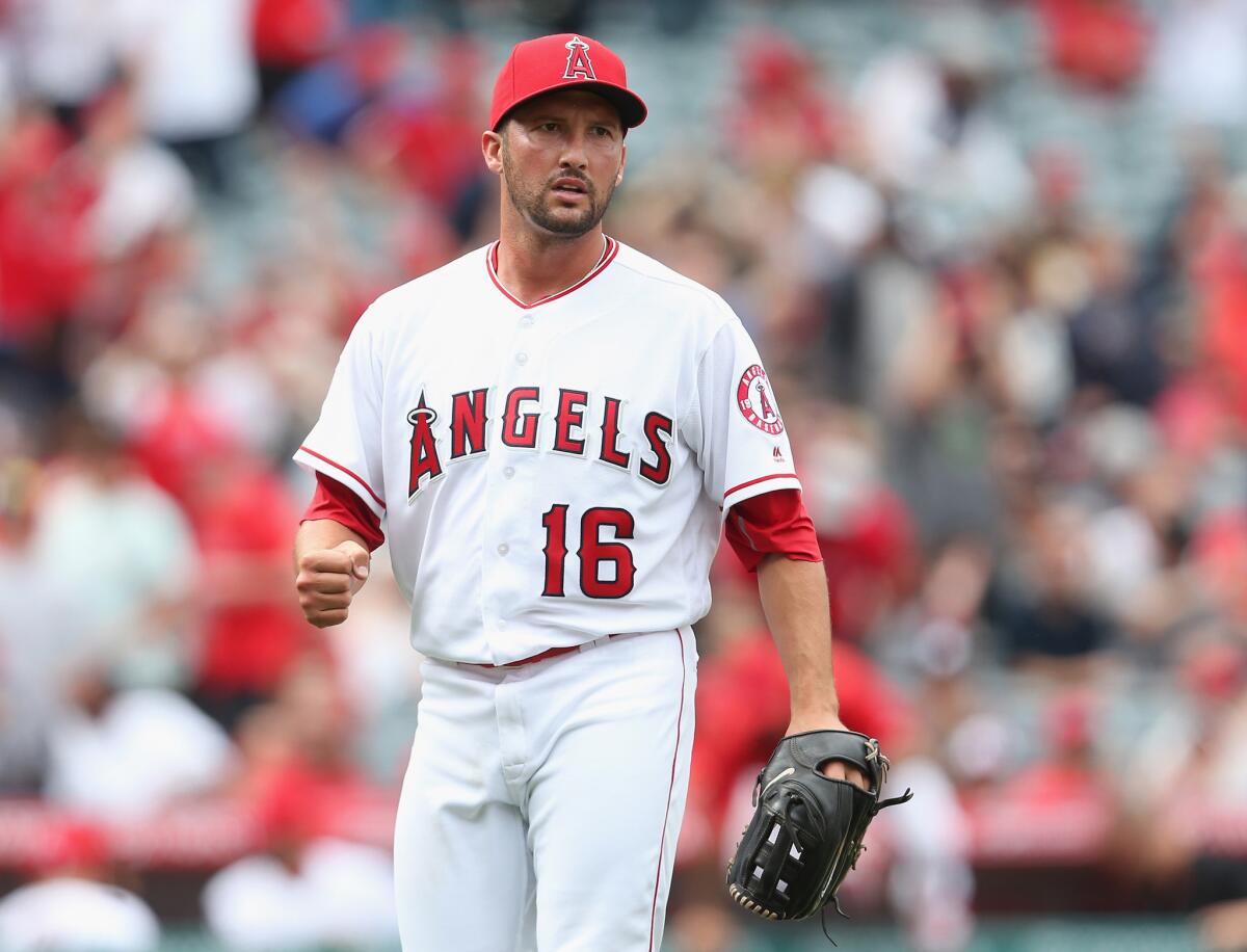Angels closer Huston Street pumps his fist after getting the final out of the ninth inning against the Texas Rangers on April 10.