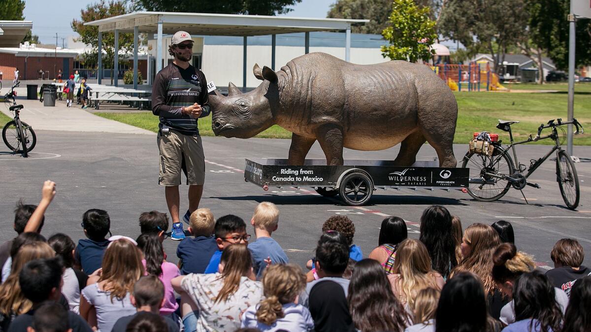 Matt Meyer, a South African safari guide, speaks to students at Circle View Elementary School in Huntington Beach about the dangers rhinoceroses face.