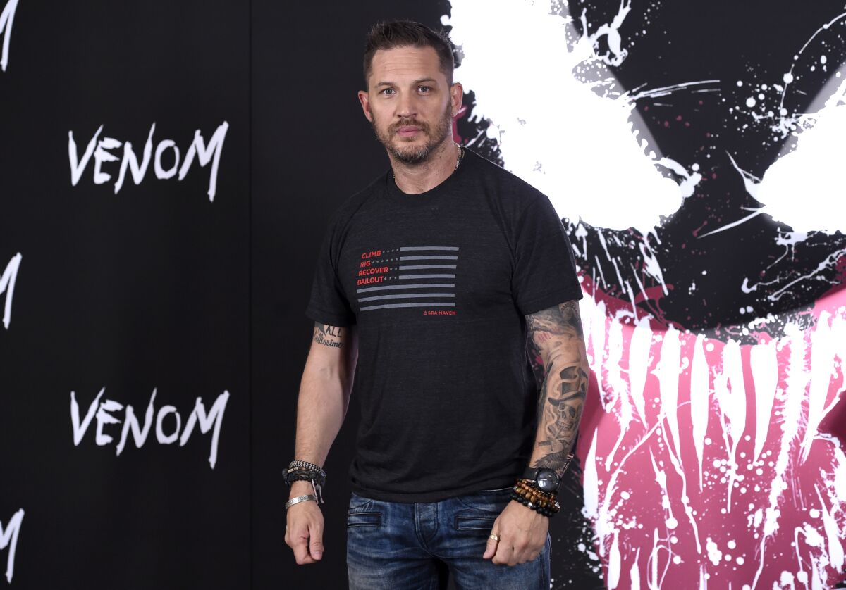 FILE - Tom Hardy attends a photo call for "Venom" on Sept. 27, 2018, in Los Angeles. In the biggest sign yet that Hollywood’s fall plans are being altered by the coronavirus surge driven by the delta variant, Sony Pictures on Thursday, Aug. 12, 2021, delayed the release of the big-budget sequel “Venom: Let There Be Carnage.” Instead of opening in theaters Sept. 24, the “Venom” sequel will now debut Oct. 15. The film, starring Hardy, had already been delayed numerous times during earlier stages of the pandemic. (Photo by Chris Pizzello/Invision/AP, File)