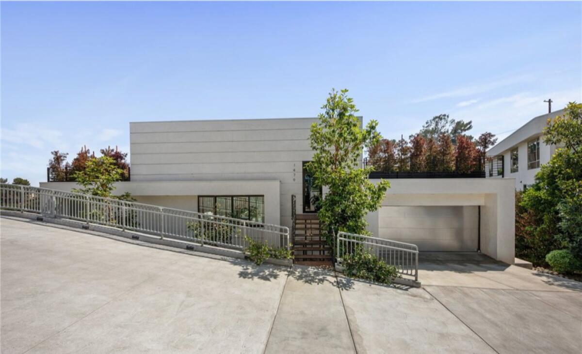 This modern five-bedroom home listed by Avo Atnalian in the hills of Highland Park is on the market for $2.498 million.