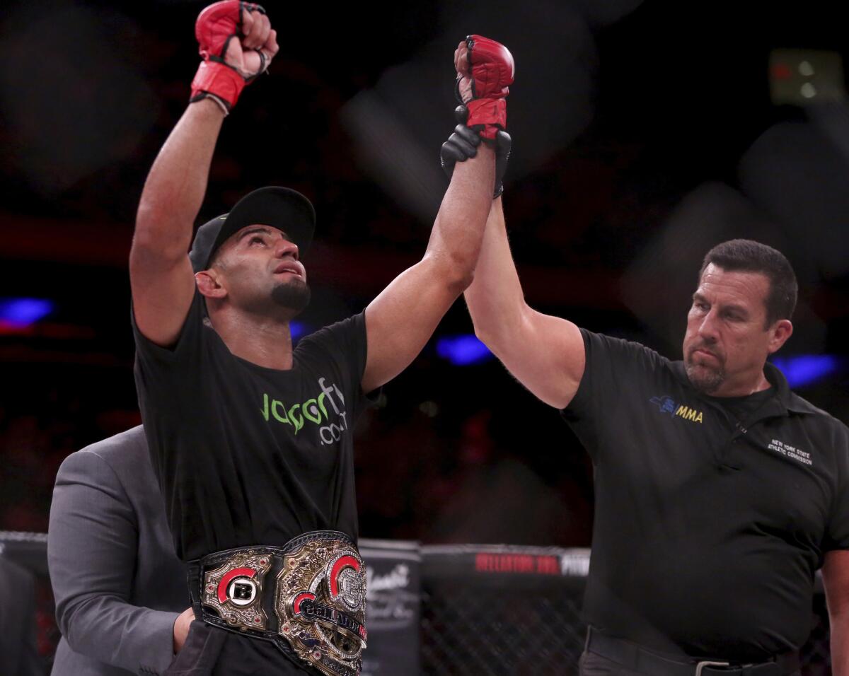 Douglas Lima celebrates after retaining his welterweight belt with a victory over Lorenz Larkin at Bellator 180 in New York City on June 24, 2017.