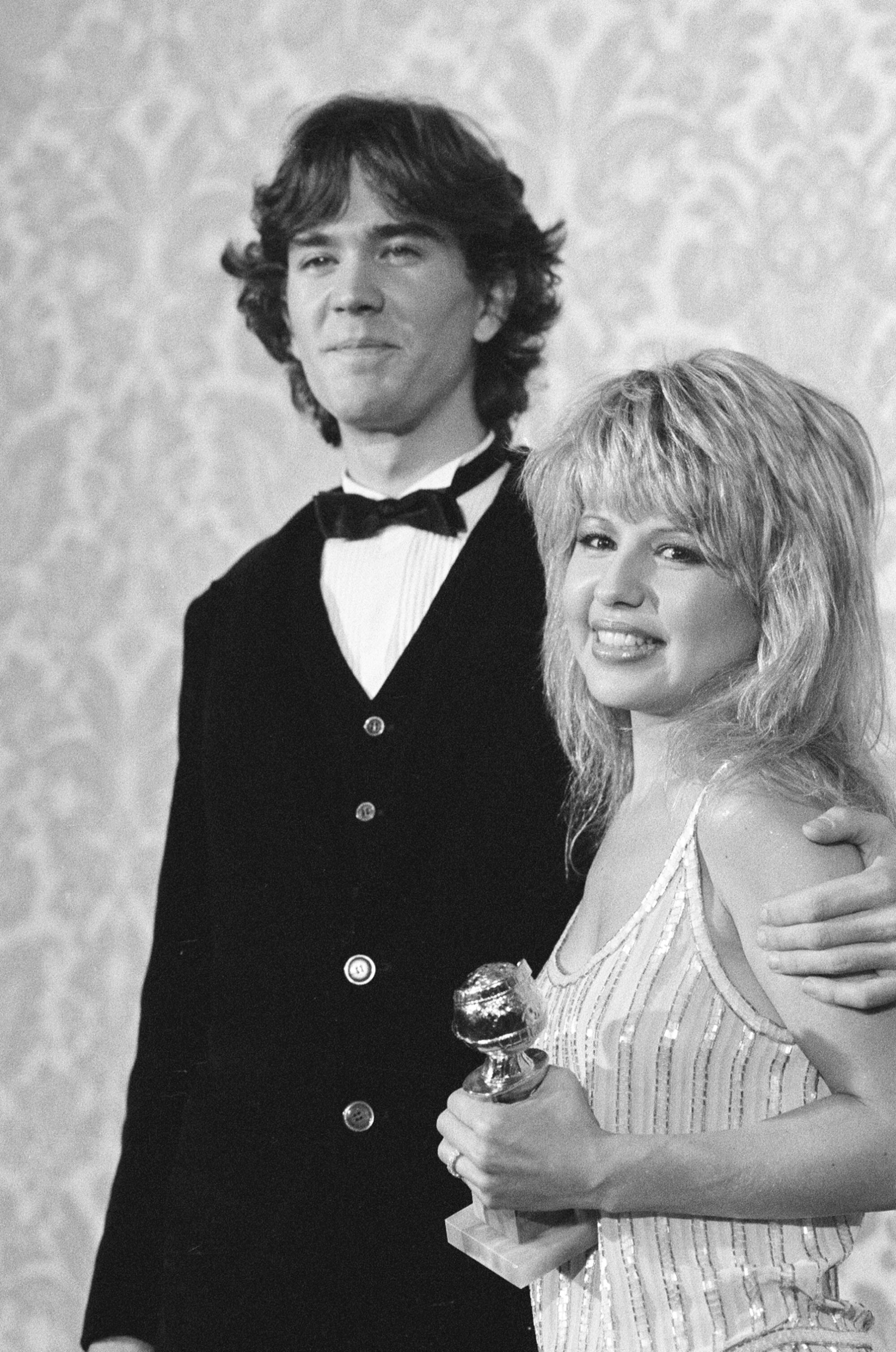 Pia Zadora holds a Golden Globes statuette in a picture with her husband