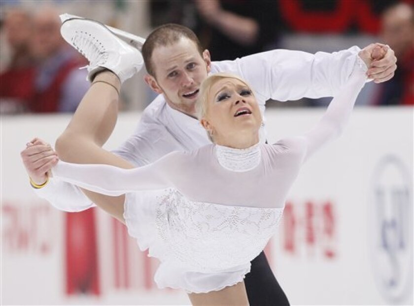 FILE - In this April 28, 2011 file photo, American pair Caitlin Yankowskas and John Coughlin perform during the free skate program at the ISU Figure Skating World championships in Moscow, Russia. Yankowskas and Coughlin, the U.S. pairs champions, are splitting up a week after finishing sixth at the world championships, U.S. Figure Skating announced Wednesday, May 4, 2011. The pair gave no reason for the end of their four-year partnership. (AP Photo/Dmitry Lovetsky, File)
