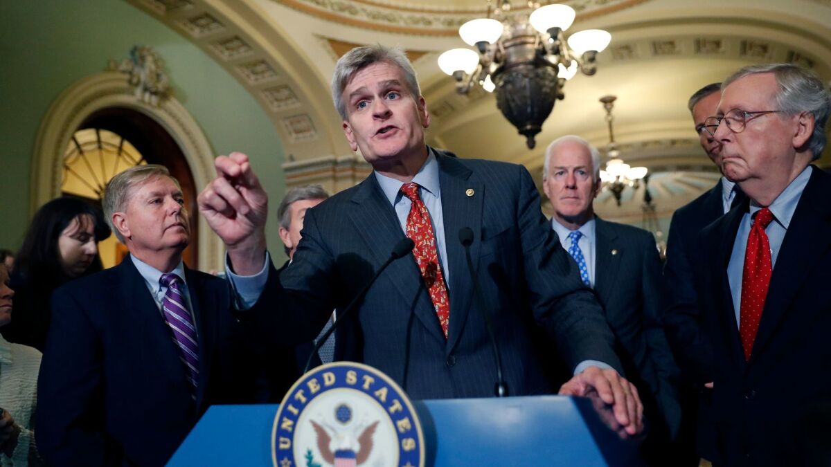 Sen. Bill Cassidy (R-La.) speaks to the media about his proposal to repeal and replace Obamacare, accompanied by Sens. Lindsey Graham (R-S.C.), John Cornyn (R-Texas) and Senate Majority Leader Mitch McConnell (R-Ky.) on Capitol Hill on Tuesday.
