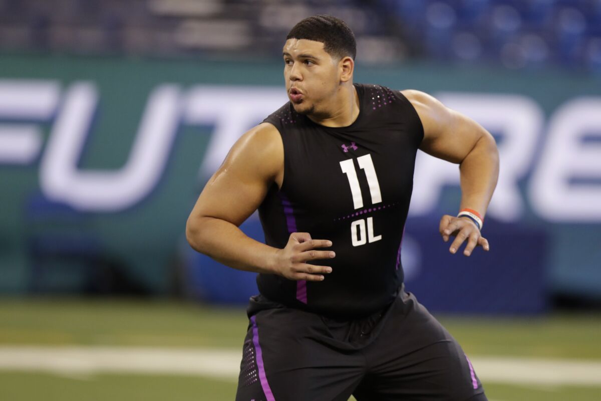 Maine offensive lineman Jamil Demby runs a drill at the NFL scouting combine.