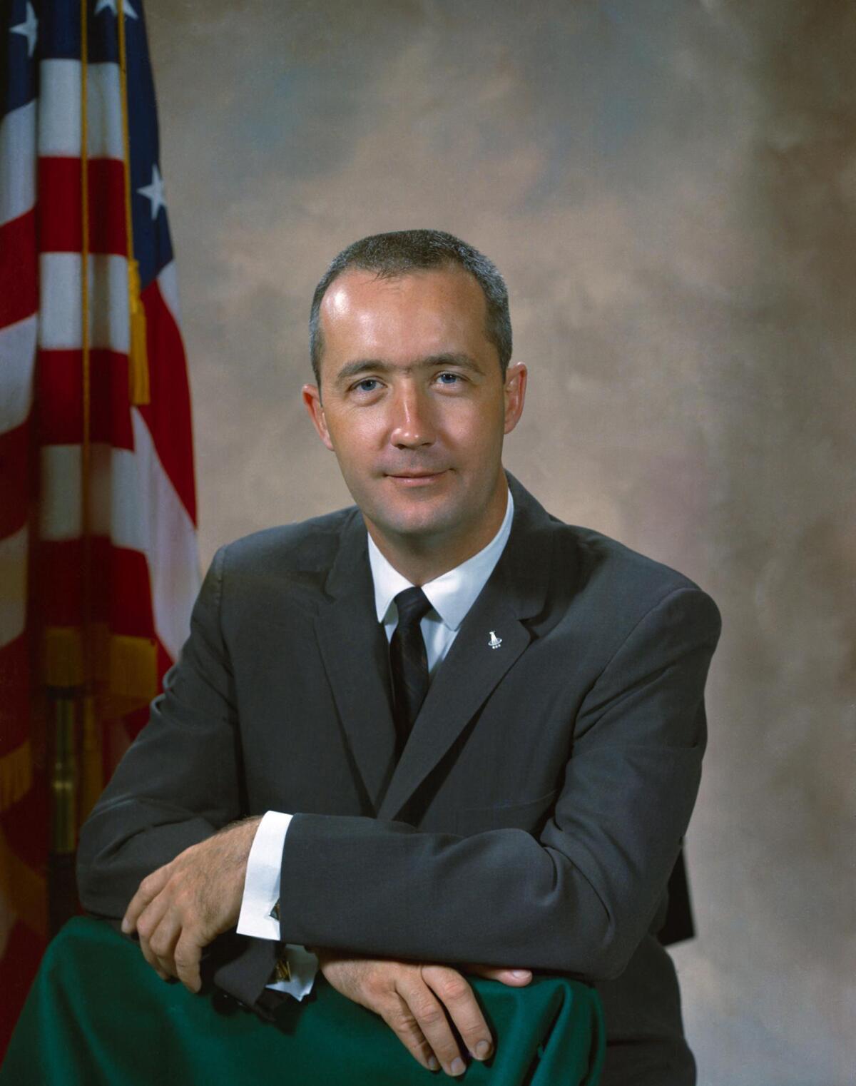 In this undated photo provided by NASA, astronaut James A. McDivitt poses for a picture. 
