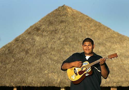 Carlos Alberto, a resident of Chacala, Mexico, plays guitar on the beach in the small Mexican seaside village 60 miles north of Puerto Vallarta.