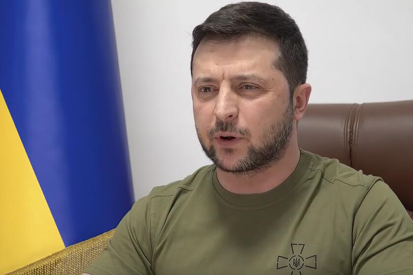 In this image from video provided by the Ukrainian Presidential Press Office and posted on Facebook, Ukrainian President Volodymyr Zelenskyy speaks to members of the U.S. Congress from Kyiv, Ukraine, on Wednesday, March 16, 2022. Zelenskyy summoned the memory of Pearl Harbor and the Sept. 11, 2001, terror attacks in appealing to the U.S. Congress to do more to help Ukraine's fight against Russia. President Joe Biden said the U.S. is sending more anti-aircraft, anti-armor weapons and drones. (Ukrainian Presidential Press Office via AP)